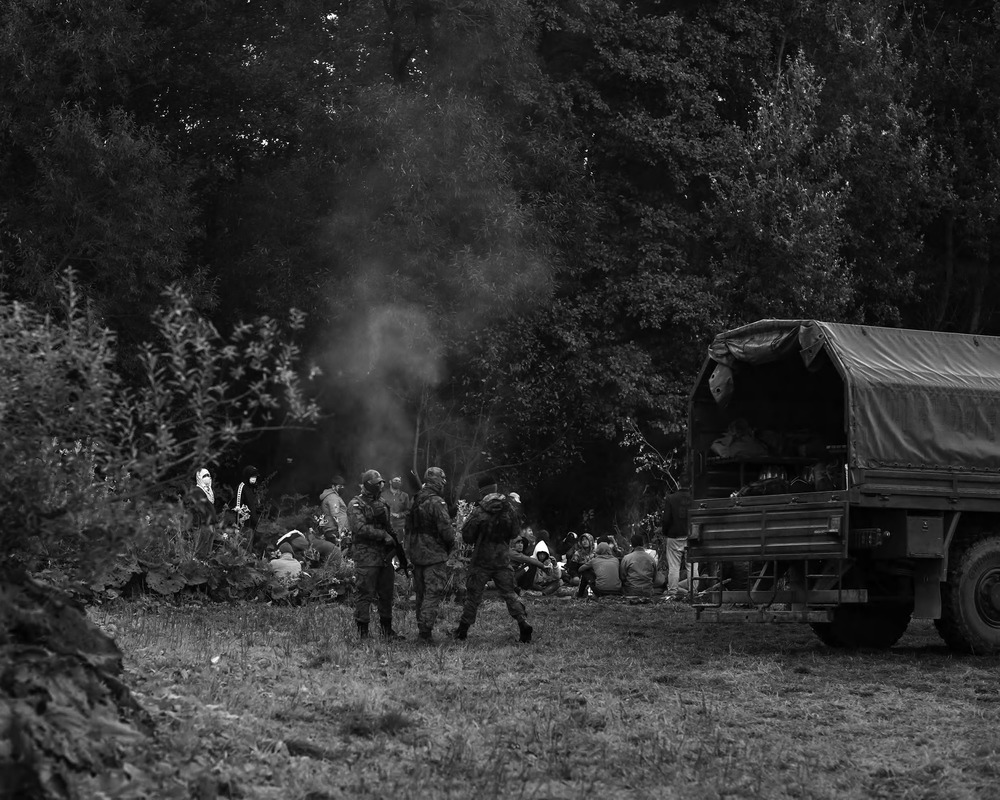 A group of Afghan refugees stopped by border guards near the Polish village of Usnarz, in August 2021.