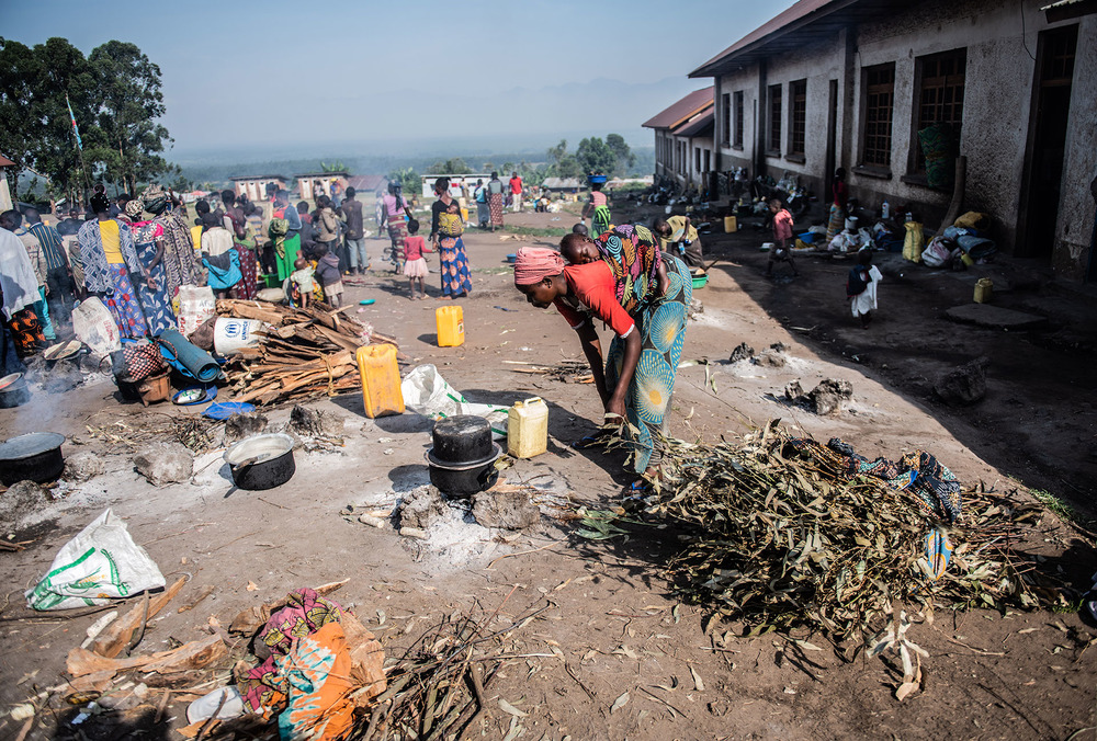 Food is cooked at a displacement camp in a primary school in Rutshuru town. Residents said they had not received food assistance from aid groups for two months.