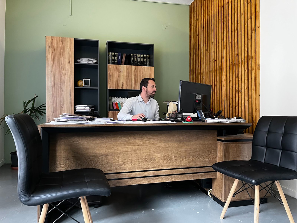 Human rights lawyer Dimitris Choulis, who has defended many asylum seekers and migrants facing smuggling charges, at his office on the Greek island of Samos. February 2022.