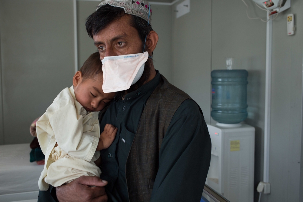 A boy and his father in a hospital