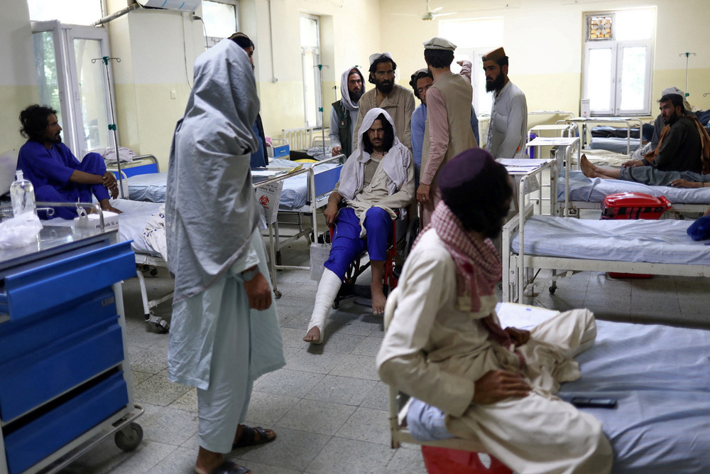 Afghanistan’s collapsing healthcare system was put under further pressure by a 22 June earthquake that killed more than 1,000 people and injured thousands, including these people receiving treatment at a hospital ward in the eastern city of Sharana.
