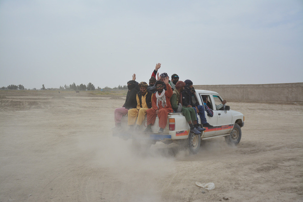 A group of Afghan migrants leaves Baluch market for Iran.