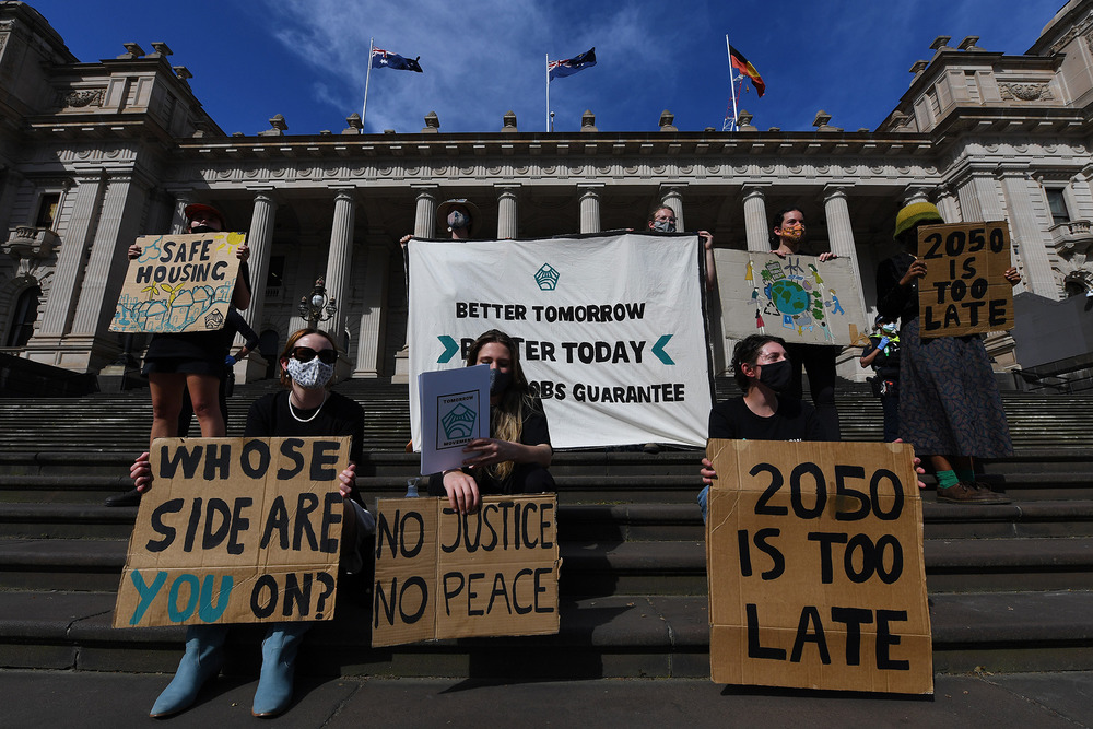Young climate activists from the Tomorrow Movement gather for a demonstration outside the Victoria state parliament in Melbourne, on 27 October 2021.