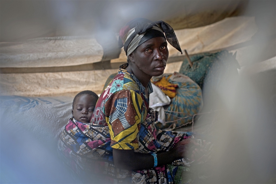 A woman and her baby take shelter at Don Bosco Orphanage in Goma, Democratic Republic of Congo