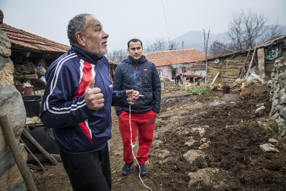 Aleksander Nackov and his father, Ljubomir, at their farmhouse in Gradina, close to the Bulgarian border where the older man says he often sees migrants passing near his home