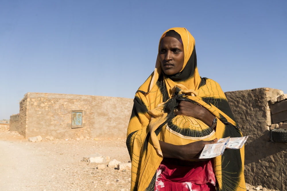Mother with a bundle of supplementary food Puntland