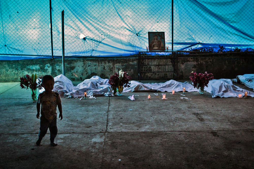 A wake was held for the first six victims whose bodies were recovered from a landslide in the village of Quejá, where an estimated 100 more people are missing