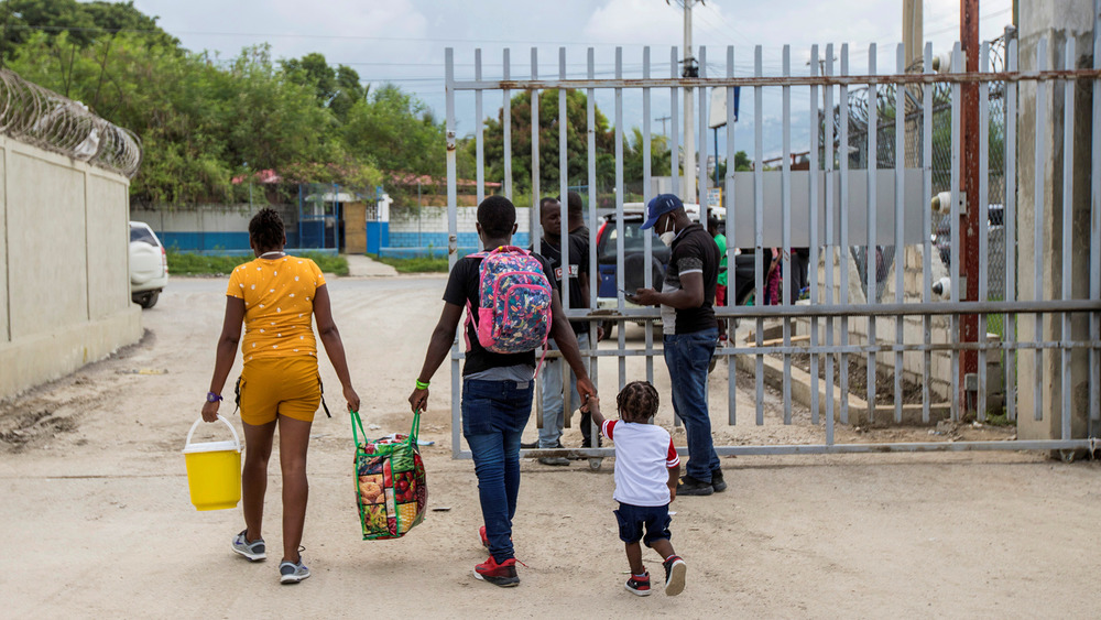 Haitians deported by the US authorities leave the airport in Haiti’s capital, Port-au-Prince, in September 2021. Thousands have been sent back despite deadly gang violence and growing hunger in their homeland.