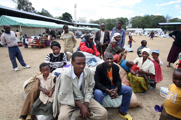 Susan Maina was forced to flee for safety with her family from Burnt forest area and now is seeks shelter at the Nakuru showground with her family. Kenya. January 2008. Many families have been displaced as a result of post election violence that occurred