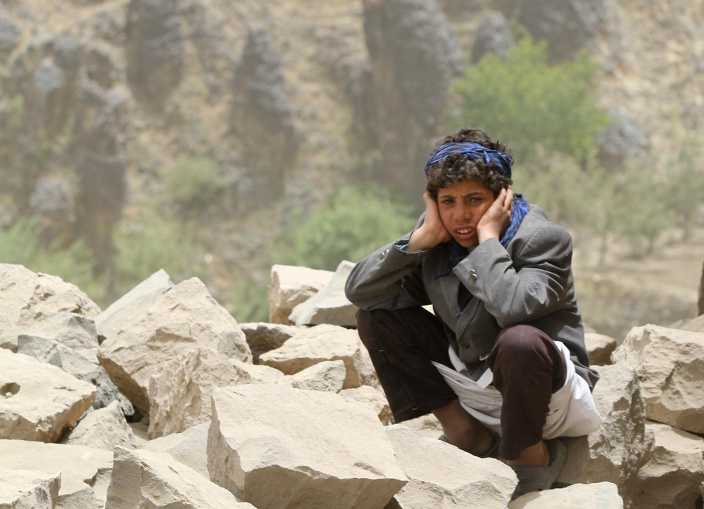 A young boy sits amid rubble all that remains of his home – which was destroyed in an air strike – in Okash Village, near Sana’a, the capital.April 4, 2015 FROM UNICEF -