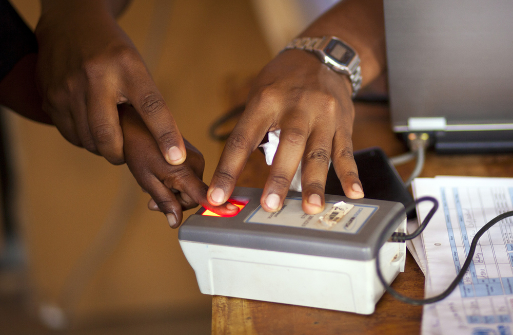 A member of a recently arrived Somali family is fingerprinted by UNHCR staff during the registration at a transit center in Dolo Ado, Ethiopia
