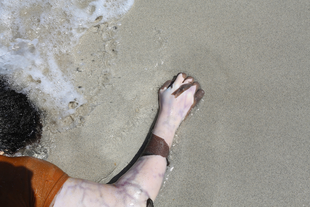 The body of a migrant or refugee washed up on the shore in Libya after a major boat crash
