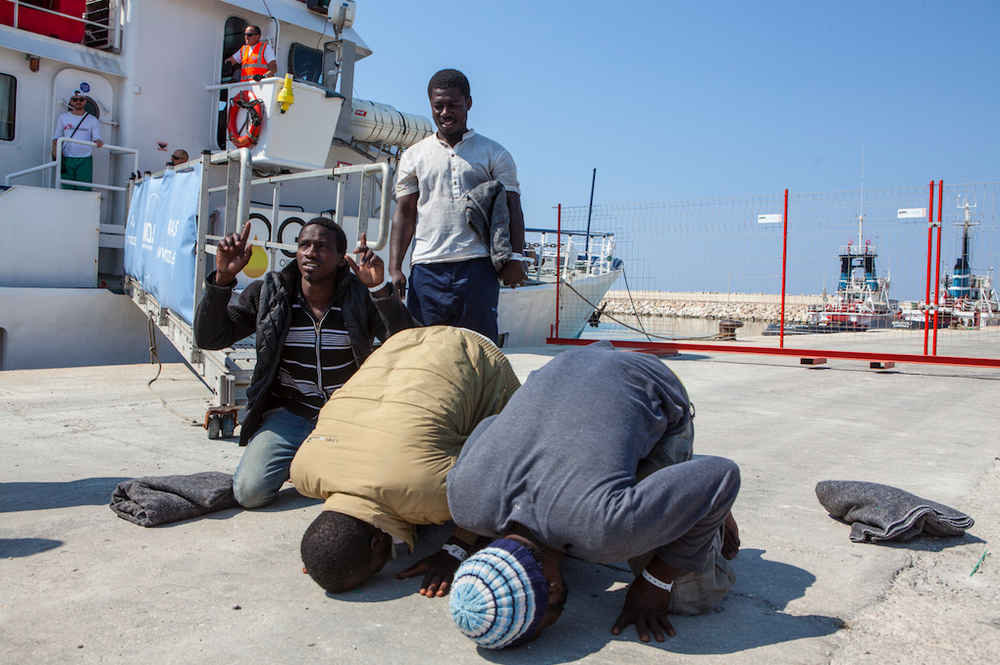 Mohammed Lamin quit his job, borrowed money from his brother, and left the Gambia for Europe via the “back way” - the highly dangerous overland route to Libya through the Sahel, and then on to Europe on a smuggler's boat. Here he is arriving in Italy.