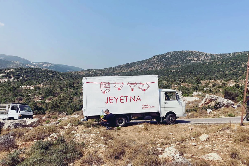 A truck bearing the logo of the period poverty awareness-raising festival Jeyetna, which distributed free period panties, reusable pads, and menstrual cups across Lebanon this summer.