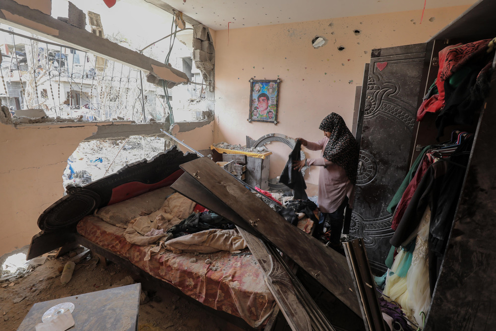 Khaldiya Enssir in the bedroom of her Gaza home, the day after it was hit by an airstrike in May 2021.