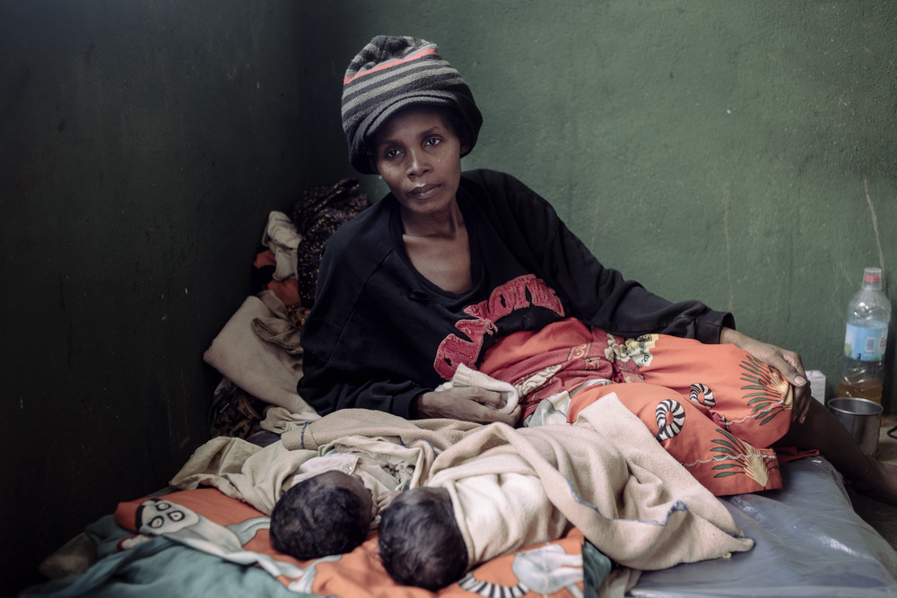 Sambetoroe Jaqueline with her malnourished twins at a clinic in Ambovombe. The health of the infants has improved after a month of treatment, but conditions at home – her dire poverty – have not.