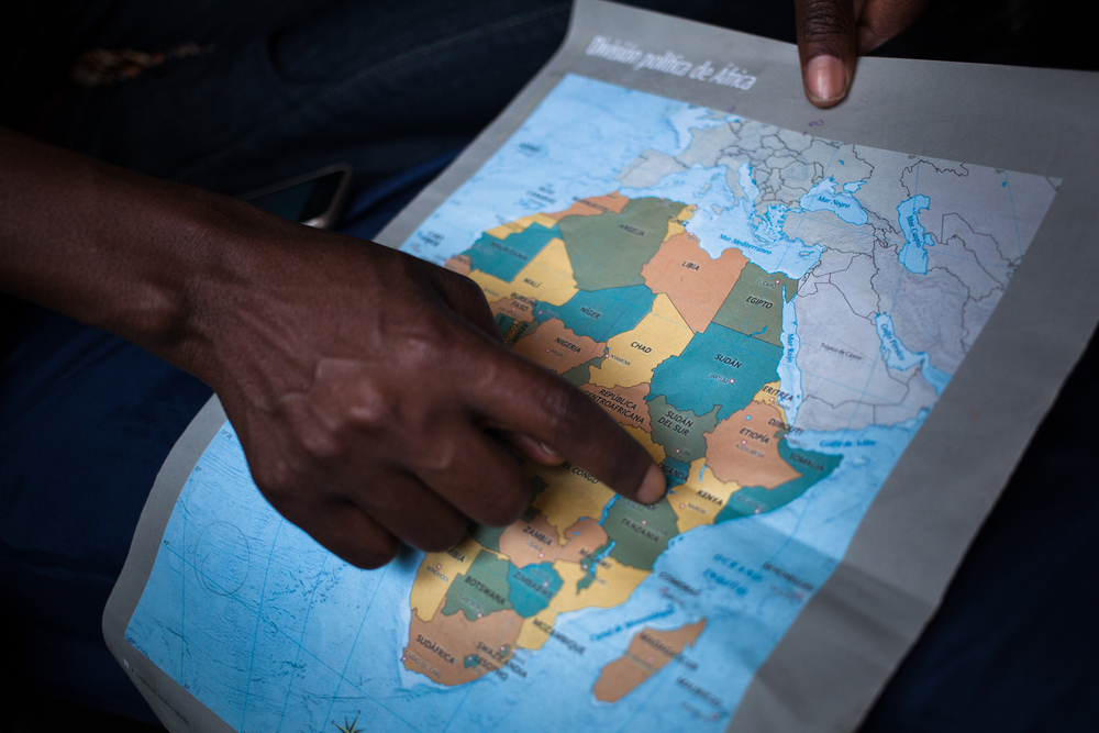 Woman pointing to a map of Africa