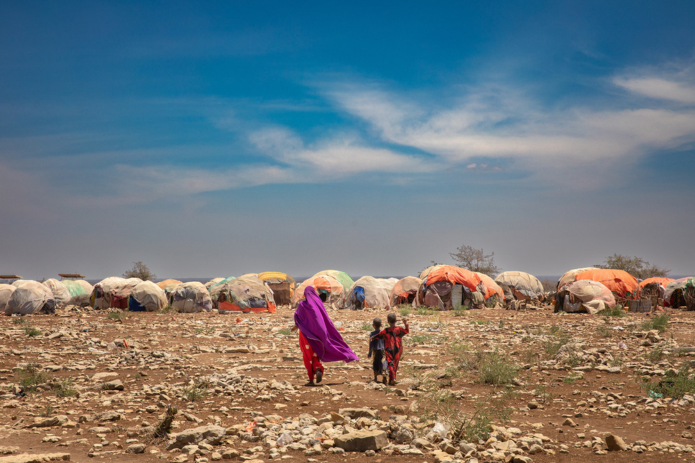 Thousands of Somalis escaping drought and conflict have been arriving every month in sprawling settlements on the outskirts of towns, like this one in Baidoa, south-central Somalia, pictured in August 2022.