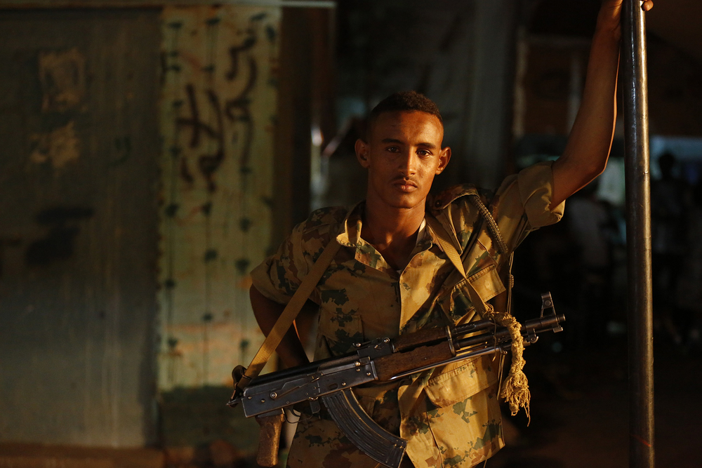 A Sudanese soldier stands guard