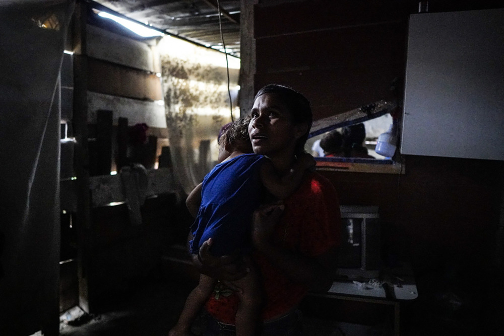 Álvarez holds her youngest child, one-year-old Isamar, who suffers persistently from diarrhoea.