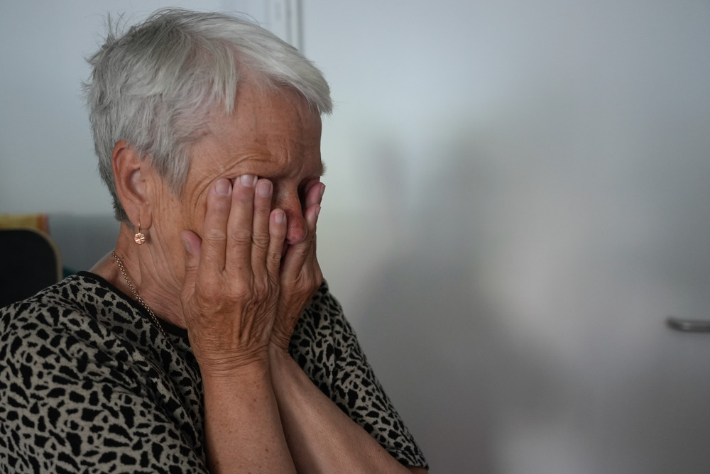 Natalia Zakharova's mother hides her face as she cries. Displaced from the frontline eastern city of Severodonetsk, she is now living in a one-room mobile home in Lviv with Natalia – who is struggling to find work – and her granddaughter.