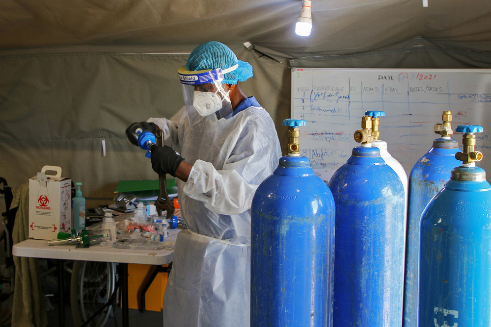 A worker prepares oxygen cylinders at a COVID-19 quarantine centre in Aden, south Yemen, on 27 March 2021.A worker prepares oxygen cylinders at a Covid-19 quarantine centre in Aden, Yemen March 27, 2021.