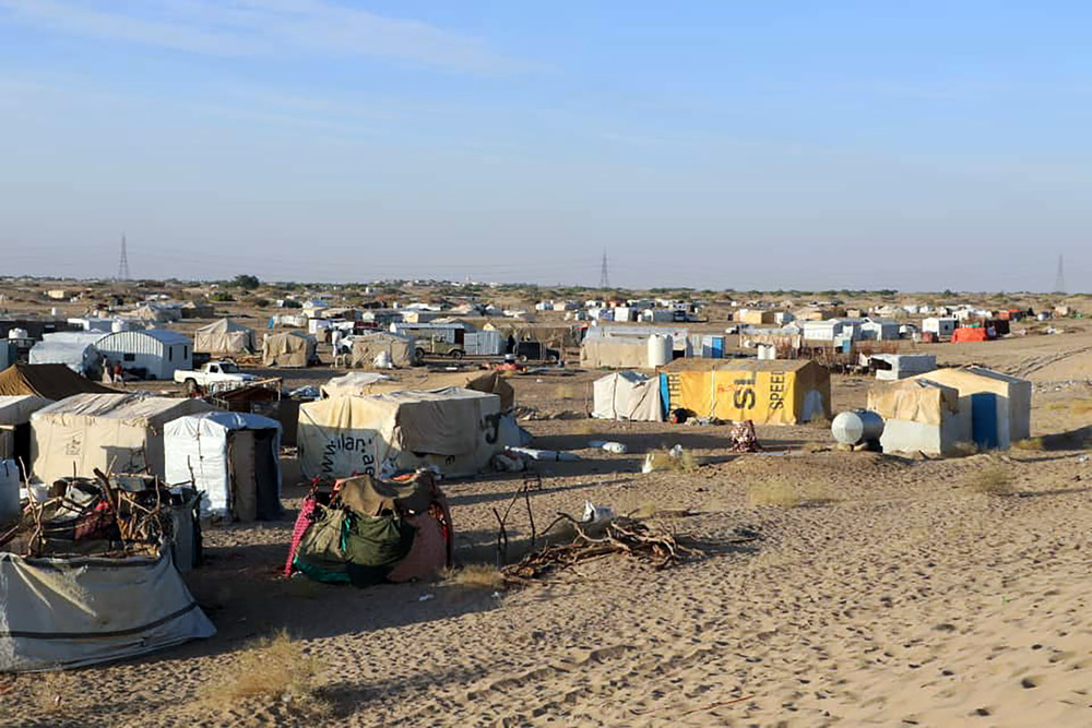 The image shows a scene of tents.