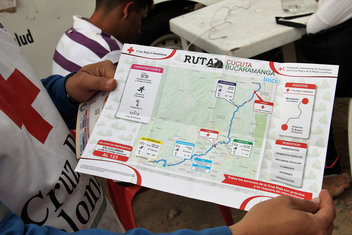 A closeup of a printed map showing a route for migrants