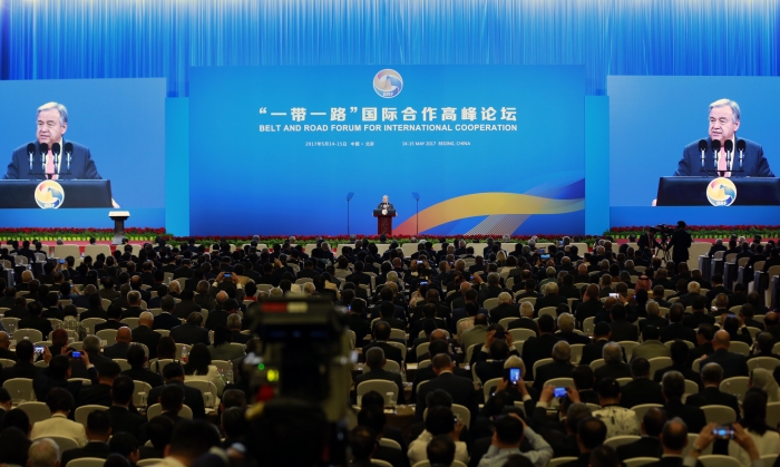 Man speaking at conference.
