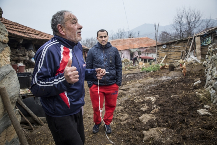 Aleksander Nackov and his father, Ljubomir, at their farmhouse in Gradina, close to the Bulgarian border where the older man says he often sees migrants passing near his home