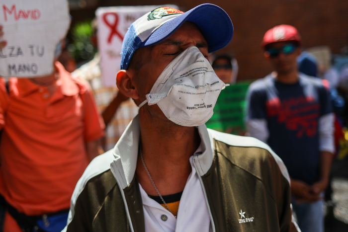 A man protesting against the lack of access to antiretroviral drugs in Caracas in 2018.