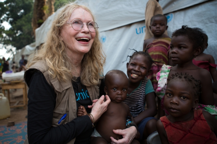 On 2 July 2015, UNICEF Goodwill Ambassador Mia Farrow greets internally displaced people (IDPs) in the Central African Republic (CAR), specifically the St. Michel displacement site near the southern town of Boda in Lobaye Prefecture.