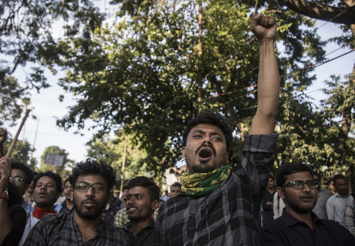 Protesters at Cotton University in Guwahati rally against changes to India’s citizenship law.