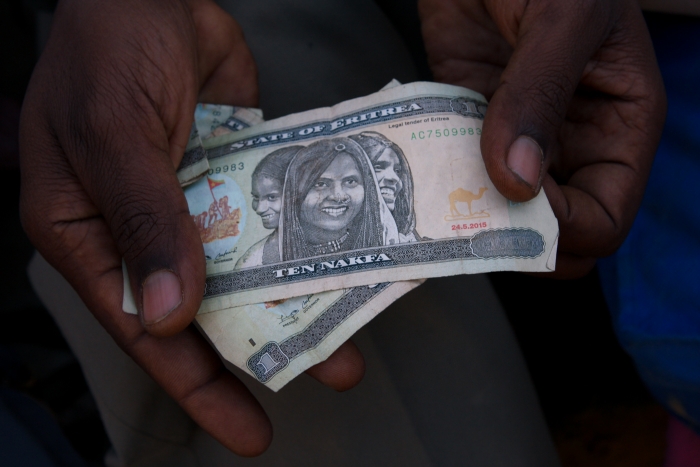 An Eritrean migrant newly arrived in Ethiopia shows the little money he has left