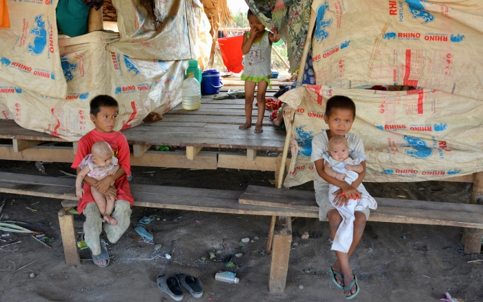 Children displaced by fighting in Myanmar's Kayin State in a makeshift shelter