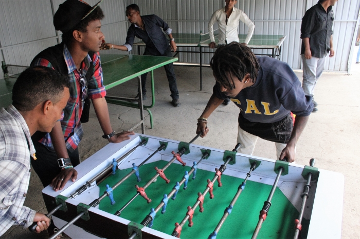 Refugees playing table football