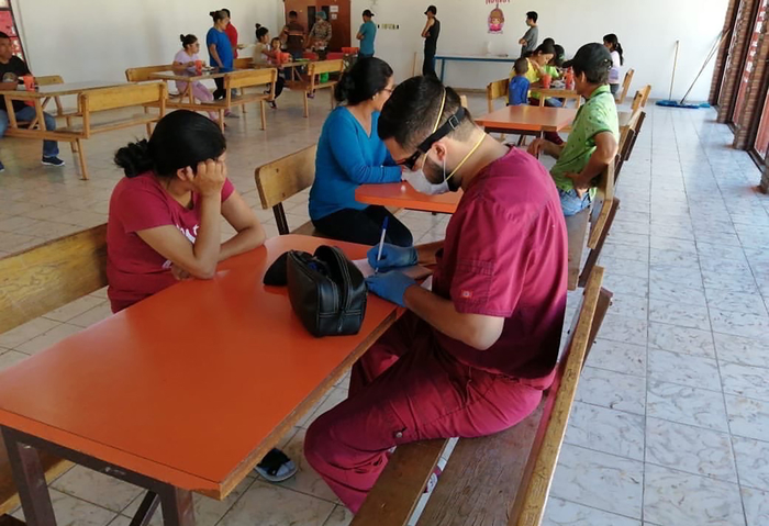 Migrants wait at the Casa del Migrante Diócesis de Ciudad Juárez