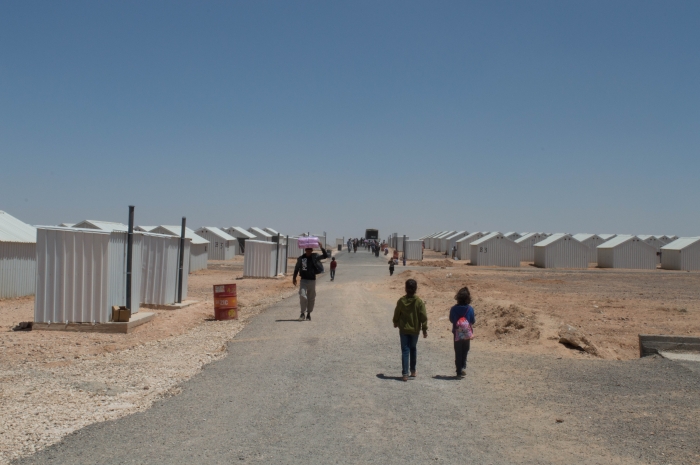 Children walking in a refugee camp