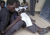 Boy attends English lesson at a military barracks in the Southern Sudanese town of Yei