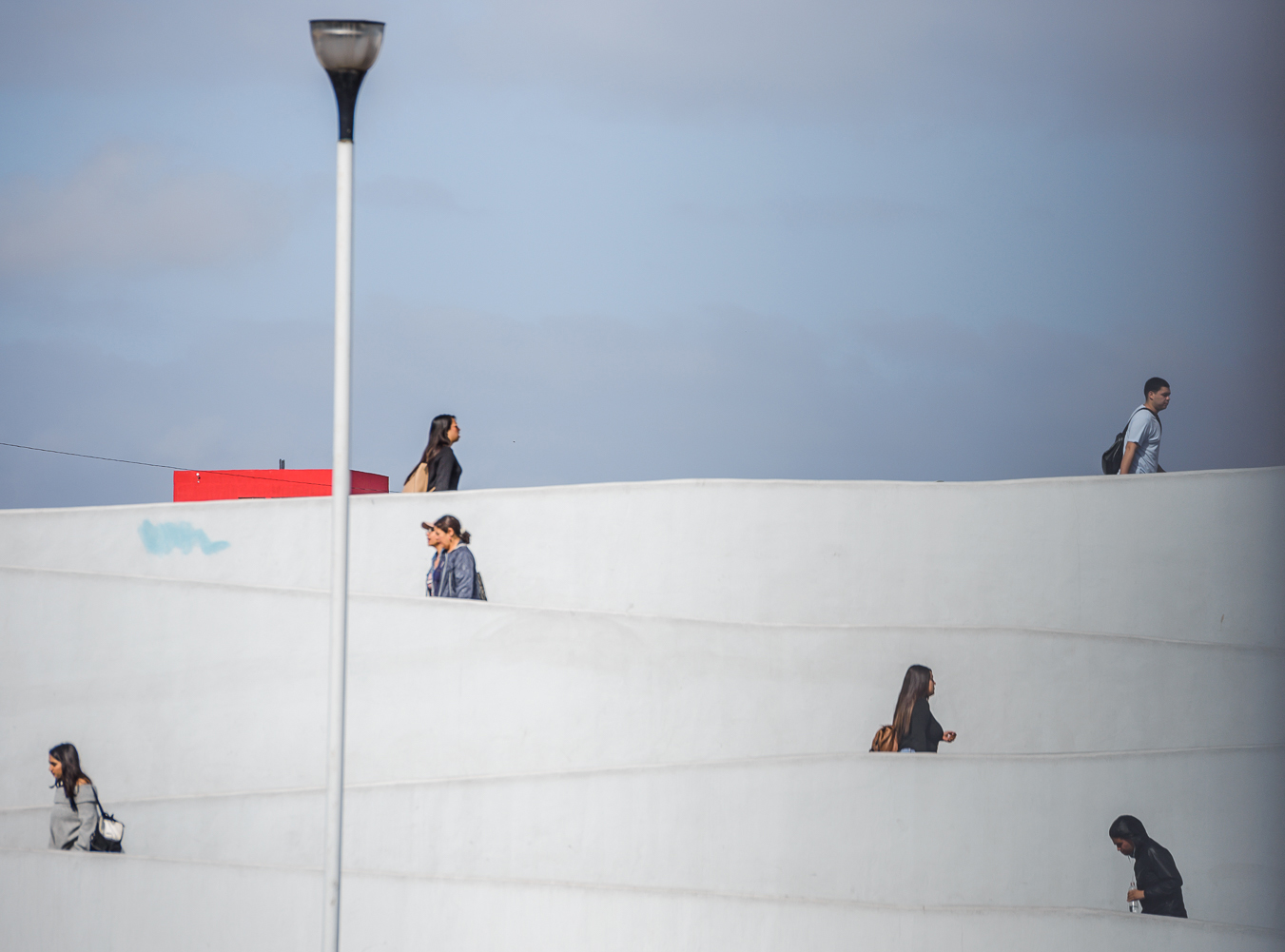 People enter the queue to cross the Mexico/US border at the El Chapparal border crossing in Tijuana, Mexico.