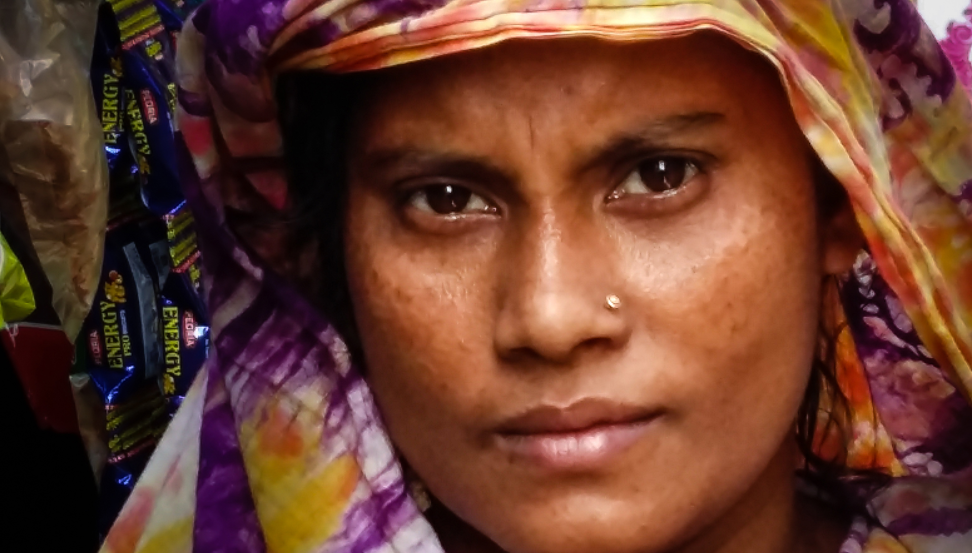 River erosion destroyed Raima Begum’s land on Bangladesh’s Bhola Island in 2009, pushing her family to a slum community in the capital, Dhaka. Portrait of a woman close up