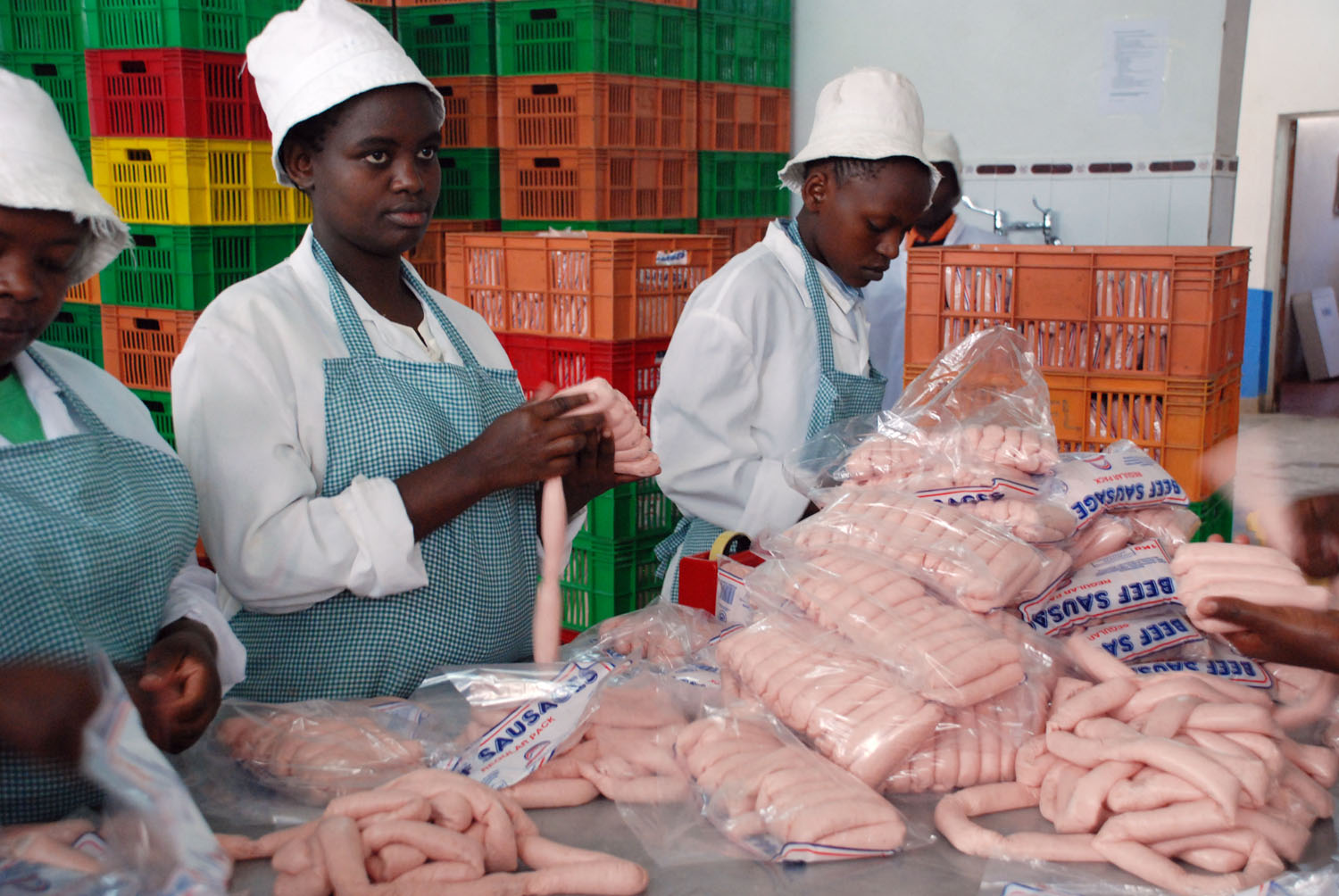 Workers packaging meat products at a plant, Nairobi, Kenya 2008.Food insecurity in Kenya has
