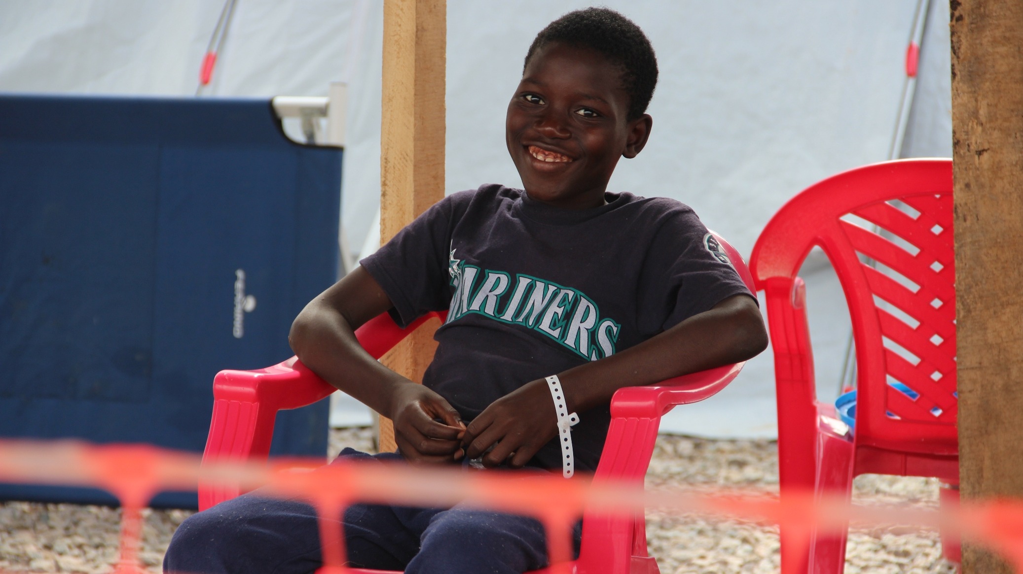 Day in the life of a Kenema Ebola treatment centre Noah, 14, on the day he was discharged from the IFRC Ebola treatment centre outside of Kenema. He lost his mother and sister to Ebola.