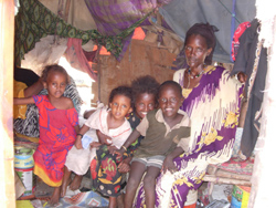 [Djibouti] Dikina Mohamed and her children inside their house in Arhiba, a slum in Djibouti City.