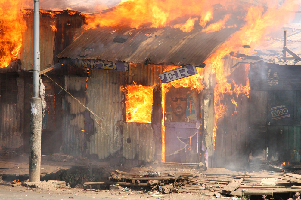 A barbershop burns in Nairobi's Mathare slum in post-election violence, December 31 2007.