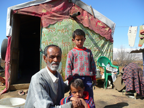 As a non-ID Palestinian, Atieh Ahmad, pictured with his two young sons, risks arrest if he strays far from his shack in Lebanon's Bekaa Valley.