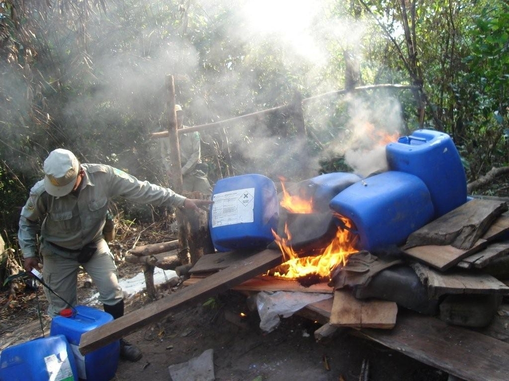A seized distillery at Mreah Prew. The wood used to make sassafras is extremely rare and becoming extinct. Large numbers of other trees are being chopped down for fire-wood for the lengthy sassafras distillation process.