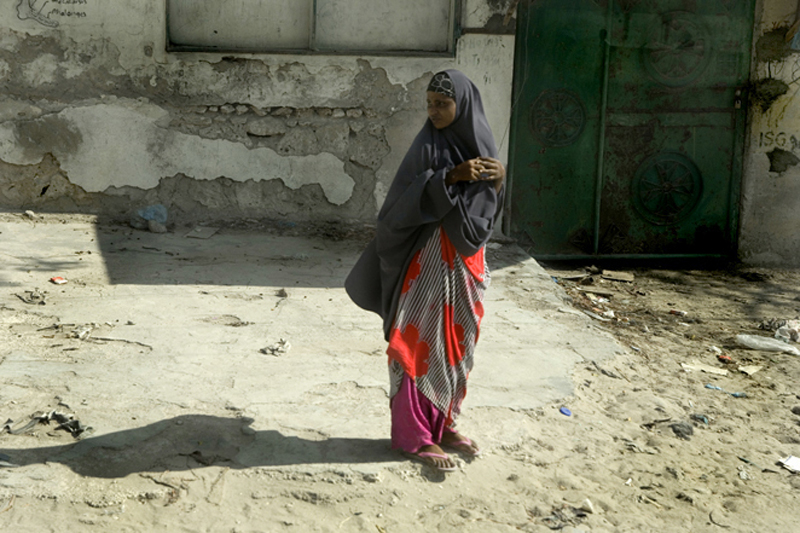 A woman walks through a street on April 4, 2010 in the capital Mogadishu. Over the years hundreds of thousands of Somalis have fled to neighbouring countries. More than one million people, in a nation the UN estimates to be nine million, are internally di