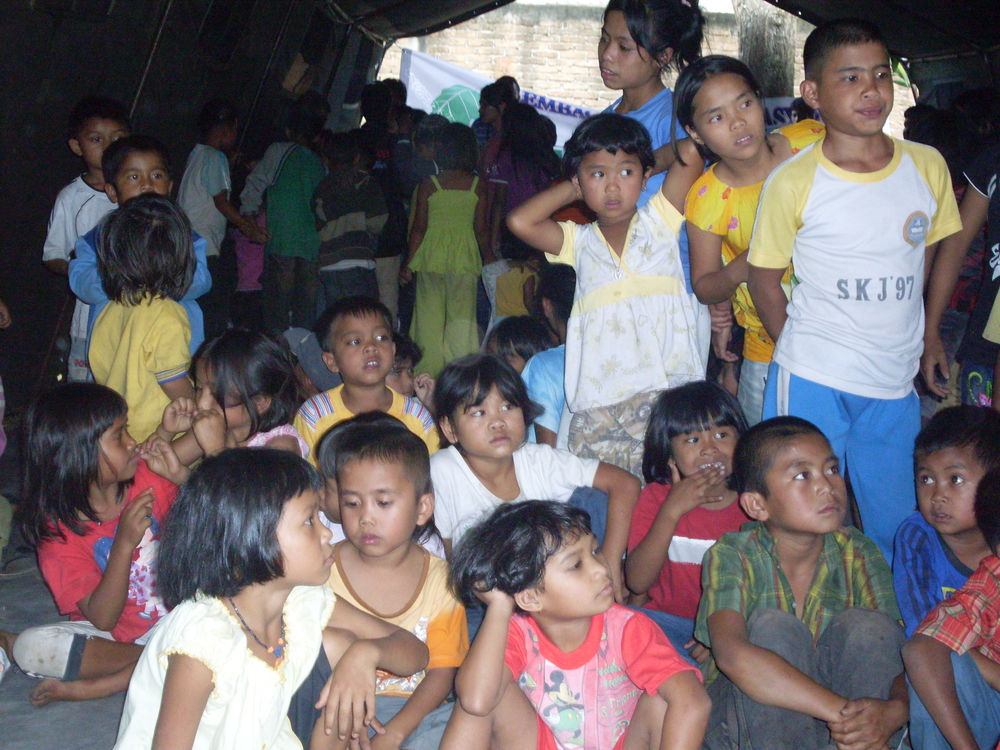 Children staying in a tent at an evacuation posts in Karo District, North Sumatra Province. Thousands fled their homes after the once dormant Mount Sinabung volcano began erupting at the end of August 2010