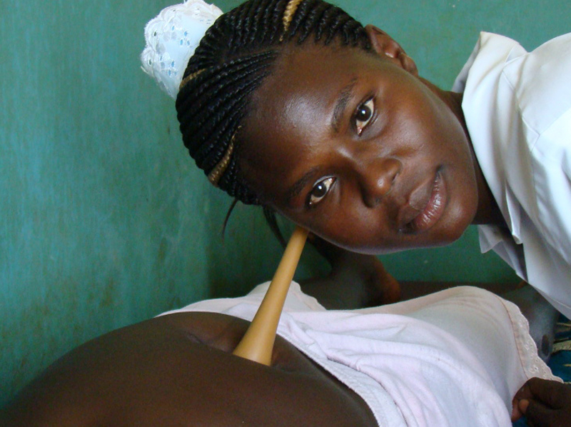 A mid wife attending to a expectant mother in a health centre in Gulu, northern Uganda
